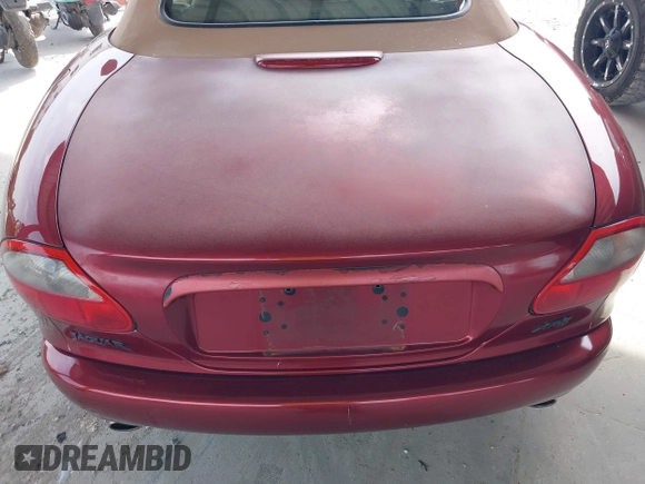 1997 Jaguar XK with VIN SAJGX274XVC004952, listed as a IAAI auction lot 42211023 with 109,889 mi miles and . Bid and sale history available at DreamBid. Image 14.