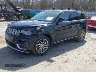 2018 Jeep Grand Cherokee Summit with VIN 1C4RJEJG2JC392847, listed as a IAAI auction lot 41751452 with 136,793 mi miles and . Bid and sale history available at DreamBid. Image 2.