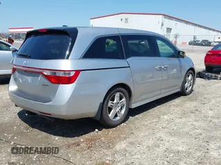 2012 Honda Odyssey Touring with VIN 5FNRL5H96CB043939, listed as a IAAI auction lot 41983643 with 202,535 mi miles. Bid and sale history available at carsss.com. Image 4.