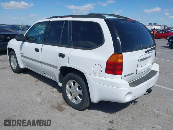 2006 GMC Envoy SLE with VIN 1GKDT13SX62258586, listed as a IAAI auction lot 42045967 with 143,225 mi miles. Bid and sale history available at carsss.com. Image 3.