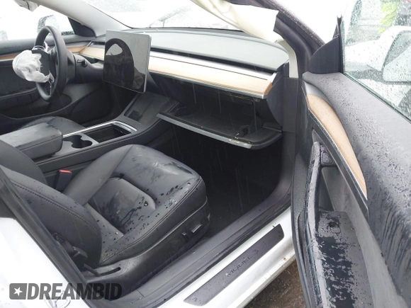 2023 Tesla Model 3 with VIN 5YJ3E1EA6PF432397, listed as a IAAI auction lot 41760895 with 15,692 mi miles and . Bid and sale history available at DreamBid. Image 5.