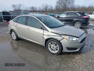 2015 Ford Focus SE with VIN 1FADP3F21FL287689, listed as a IAAI auction lot 41960075 with 87,079 mi miles and . Bid and sale history available at DreamBid. Image 1.