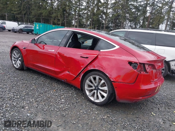 2018 Tesla Model 3 Long Range Battery z VIN 5YJ3E1EB2JF087823, wystawiony jako IAAI lot #41903609 z przebiegiem 69 749 mil mil oraz . Historia ofert i sprzedaży dostępna na DreamBid. Obrazek 3.
