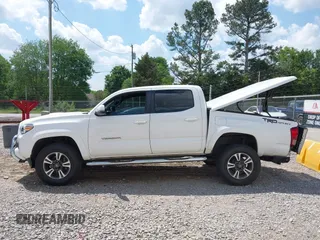 2017 Toyota Tacoma SR5 z VIN 5TFAZ5CN6HX047115, wystawiony jako IAAI lot #42124289 z przebiegiem 133 245 mil mil oraz . Historia ofert i sprzedaży dostępna na DreamBid. Obrazek 14.