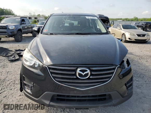 2016 Mazda CX-5 Sport with VIN JM3KE4BY6G0749973, listed as a Copart auction lot 54131635 with 97,480 mi miles and Salvage title. Bid and sale history available at DreamBid. Image 5.