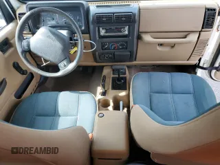 1999 Jeep Wrangler Sahara z VIN 1J4FY49S0XP432968, wystawiony jako Copart lot #65033715 z przebiegiem 126 420 mil mil oraz Szkoda całkowita • Salvage title. Historia ofert i sprzedaży dostępna na DreamBid. Obrazek 8.
