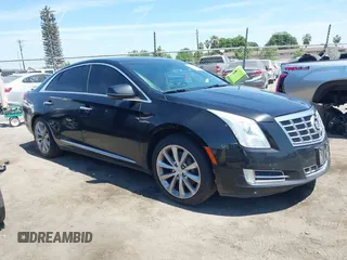 2013 Cadillac XTS Luxury z VIN 2G61R5S32D9226506, wystawiony jako IAAI lot #42208105 z przebiegiem 140 255 mil mil oraz . Historia ofert i sprzedaży dostępna na DreamBid. Obrazek 13.