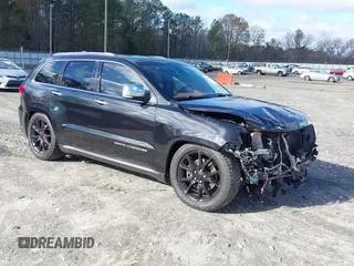 2015 Jeep Grand Cherokee Summit with VIN 1C4RJFJTXFC889977, listed as a IAAI auction lot 41078216 with 71,038 mi miles. Bid and sale history available at carsss.com. Image 1.