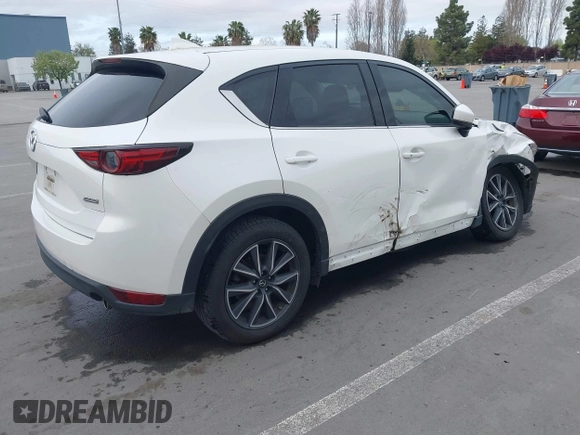 2018 Mazda CX-5 Grand Touring with VIN JM3KFADM1J0309995, listed as a IAAI auction lot 41977003 with 75,303 mi miles. Bid and sale history available at carsss.com. Image 4.