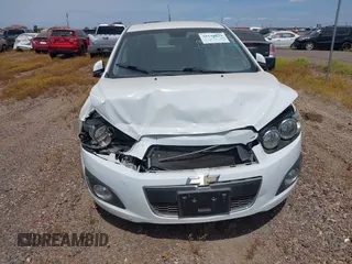 2014 Chevrolet Sonic LTZ with VIN 1G1JE5SB4E4227749, listed as a IAAI auction lot 38965556 with 69,550 mi miles. Bid and sale history available at carsss.com. Image 6.