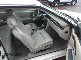 1997 Cadillac Eldorado ESC z VIN 1G6EL12Y6VU614754, wystawiony jako IAAI lot #41543611 z przebiegiem 73 273 mil mil oraz . Historia ofert i sprzedaży dostępna na DreamBid. Obrazek 5.