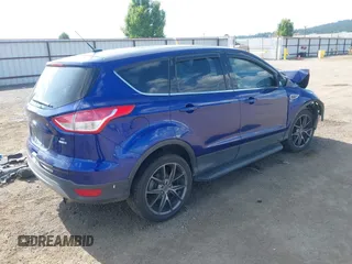 2013 Ford Escape SE with VIN 1FMCU9GXXDUB70983, listed as a IAAI auction lot 42432050 with 97,515 mi miles and . Bid and sale history available at DreamBid. Image 4.