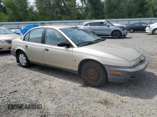 1999 Saturn SL z VIN 1G8ZH5283XZ349797, wystawiony jako Copart lot #58221955 z przebiegiem 148 506 mil mil oraz Nie do naprawy. Historia ofert i sprzedaży dostępna na DreamBid. Obrazek 4.