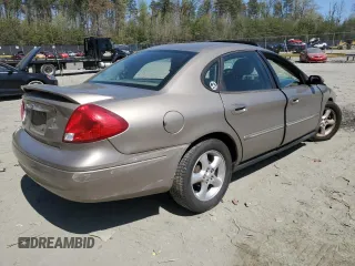 2003 Ford Taurus SEL Deluxe with VIN 1FAHP56SX3G199970, listed as a Copart auction lot 53042795 with 212,802 mi miles and Salvage Title. Bid and sale history available at DreamBid. Image 3.