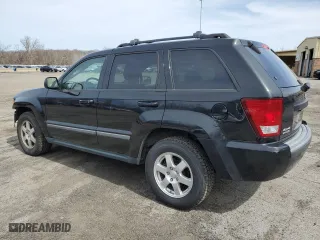 2009 Jeep Grand Cherokee Laredo with VIN 1J8GR48K79C537213, listed as a Copart auction lot 51222395 with 148,838 mi miles and Salvage Title. Bid and sale history available at carsss.com. Image 2.