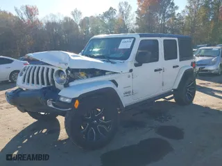 2019 Jeep Wrangler Unlimited Sahara with VIN 1C4HJXEN1KW687924, listed as a IAAI auction lot 41082030 with 65,852 mi miles. Bid and sale history available at carsss.com. Image 2.