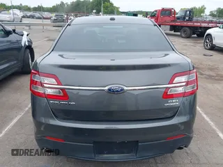 2015 Ford Taurus SEL with VIN 1FAHP2E81FG163058, listed as a IAAI auction lot 42221098 with 127,957 mi miles and . Bid and sale history available at carsss.com. Image 16.
