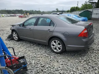 2012 Ford Fusion SE with VIN 3FAHP0HA0CR355529, listed as a Copart auction lot 62585515 with 113,094 mi miles and Salvage title. Bid and sale history available at DreamBid. Image 2.