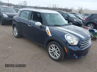 2015 MINI Countryman with VIN WMWZB3C56FWR44706, listed as a IAAI auction lot 41921628 with 128,530 mi miles and . Bid and sale history available at DreamBid. Image 1.