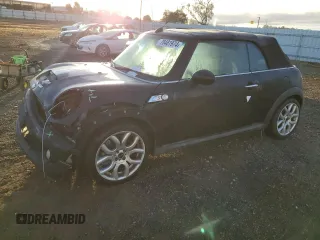 2010 MINI Convertible S with VIN WMWMS3C55ATY09477, listed as a Copart auction lot 78481974 with 102,954 mi miles and Salvage Title. Bid and sale history available at DreamBid. Image 1.