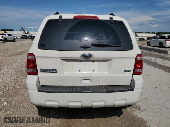 2012 Ford Escape XLT z VIN 1FMCU9DG2CKB54288, wystawiony jako Copart lot #61569655 z przebiegiem 169 899 mil mil oraz Szkoda całkowita • Salvage title. Historia ofert i sprzedaży dostępna na DreamBid. Obrazek 6.