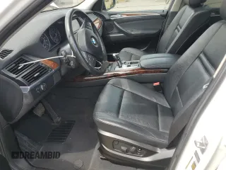 2012 BMW X5 35i with VIN 5UXZV4C54CL763857, listed as a Copart auction lot 57943195 with 143,522 mi miles and Salvage title. Bid and sale history available at DreamBid. Image 7.