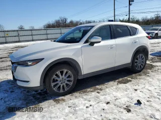 2021 Mazda CX-5 Grand Touring with VIN JM3KFBDM3M1305807, listed as a Copart auction lot 42713655 with 58,162 mi miles and Salvage Title. Bid and sale history available at carsss.com. Image 1.