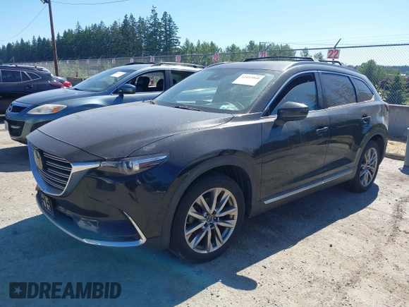 2018 Mazda CX-9 Grand Touring z VIN JM3TCBDY2J0237050, wystawiony jako IAAI lot #42457060 z przebiegiem 130 625 mil mil oraz . Historia ofert i sprzedaży dostępna na DreamBid. Obrazek 2.
