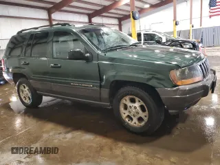 2000 Jeep Grand Cherokee Laredo with VIN 1J4GW48S2YC256123, listed as a Copart auction lot 56015855 with 147,549 mi miles and Salvage title. Bid and sale history available at DreamBid. Image 4.