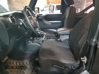 2014 Jeep Wrangler Sport with VIN 1C4AJWAG5EL307945, listed as a Copart auction lot 60152035 with 119,508 mi miles and Salvage title. Bid and sale history available at DreamBid. Image 7.