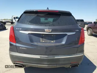2019 Cadillac XT5 Luxury FWD with VIN 1GYKNCRS1KZ131818, listed as a Copart auction lot 49354595 with 131,995 mi miles and Salvage Title. Bid and sale history available at DreamBid. Image 6.