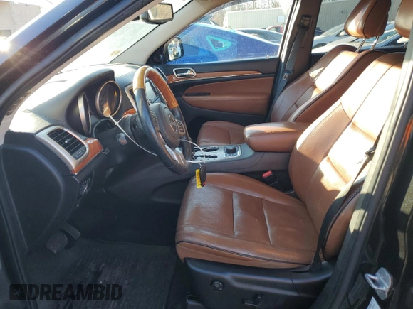 2013 Jeep Grand Cherokee Overland with VIN 1C4RJFCTXDC525097, listed as a Copart auction lot 42250875 with 214,368 mi miles and Salvage Title. Bid and sale history available at carsss.com. Image 7.