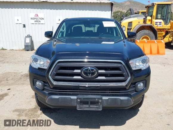 2023 Toyota Tacoma SR with VIN 3TMCZ5AN1PM654572, listed as a IAAI auction lot 42312575 with 14,111 mi miles and . Bid and sale history available at DreamBid. Image 12.