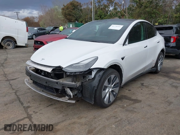 2023 Tesla Model Y Long Range z VIN 7SAYGDEE4PF621640, wystawiony jako IAAI lot #41796502 z przebiegiem 68 484 mil mil oraz . Historia ofert i sprzedaży dostępna na DreamBid. Obrazek 2.