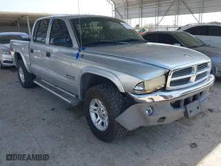2002 Dodge Dakota SLT with VIN 1B7HG48N62S546119, listed as a IAAI auction lot 41826998 with 157,761 mi miles. Bid and sale history available at carsss.com. Image 1.