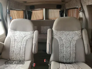 2004 Chevrolet Express Passenger z VIN 1GBFG15X641214559, wystawiony jako Copart lot #78751864 z przebiegiem 162 991 mil mil oraz Szkoda całkowita • Salvage title. Historia ofert i sprzedaży dostępna na DreamBid. Obrazek 10.