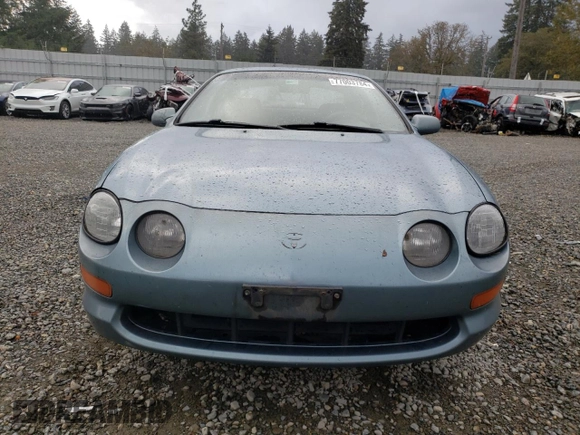1995 Toyota Celica ST with VIN JT2AT00N7S0047304, listed as a Copart auction lot 77003784 with 423,438 mi miles and Salvage Title. Bid and sale history available at carsss.com. Image 5.