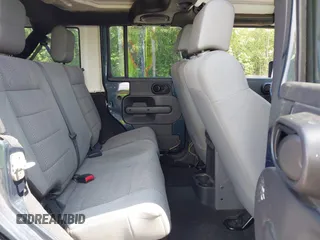 2007 Jeep Wrangler Unlimited Sahara with VIN 1J4GA59117L216687, listed as a IAAI auction lot 42188257 with 176,507 mi miles and . Bid and sale history available at DreamBid. Image 8.