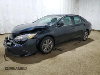 2015 Toyota Camry XLE with VIN 4T1BF1FK3FU077674, listed as a Copart auction lot 52679985 with 128,417 mi miles and Salvage Title. Bid and sale history available at DreamBid. Image 1.