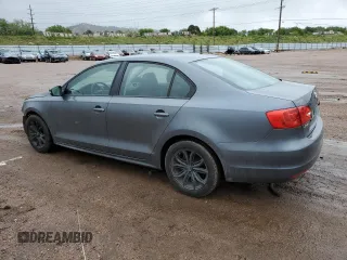 2012 Volkswagen Jetta SE z VIN 3VWDX7AJ7CM124472, wystawiony jako Copart lot #58871595 z przebiegiem 143 563 mil mil oraz Czysty tytuł • Clean title. Historia ofert i sprzedaży dostępna na DreamBid. Obrazek 2.