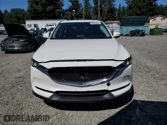 2018 Mazda CX-5 Grand Touring with VIN JM3KFBDM0J0419989, listed as a Copart auction lot 62868005 with 120,217 mi miles and Salvage title. Bid and sale history available at DreamBid. Image 5.