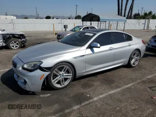 2015 BMW 6 Series 640i with VIN WBA6A0C58FD318185, listed as a Copart auction lot 74079814 with 77,054 mi miles and Salvage Title. Bid and sale history available at carsss.com. Image 1.