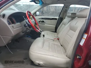 1999 Lincoln Town Car Signature with VIN 1LNHM82W7XY612906, listed as a Copart auction lot 50777435 with 110,414 mi miles and Salvage title. Bid and sale history available at DreamBid. Image 7.