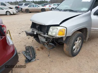 2005 GMC Envoy SLT with VIN 1GKDT13S452263166, listed as a IAAI auction lot 41543466 with 166,999 mi miles. Bid and sale history available at carsss.com. Image 6.