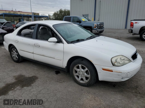 2001 Mercury Sable with VIN 1MEFM53U31A629921, listed as a Copart auction lot 77173754 with 122,769 mi miles and Salvage title. Bid and sale history available at DreamBid. Image 4.
