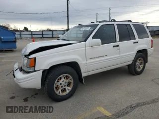 1998 Jeep Grand Cherokee Limited with VIN 1J4GZ78Y5WC259043, listed as a Copart auction lot 43976955 with 212,910 mi miles and Salvage Title. Bid and sale history available at carsss.com. Image 1.