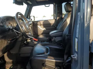 2015 Jeep Wrangler Unlimited Rubicon with VIN 1C4BJWFG7FL732694, listed as a Copart auction lot 42977435 with 128,759 mi miles and Salvage Title. Bid and sale history available at carsss.com. Image 7.