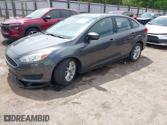 2018 Ford Focus SE with VIN 1FADP3F20JL312395, listed as a IAAI auction lot 42110335 with 110,720 mi miles and . Bid and sale history available at DreamBid. Image 2.