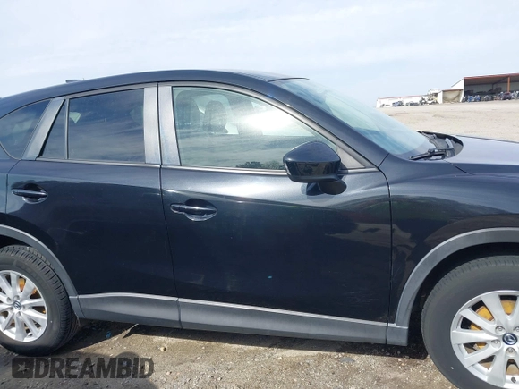 2014 Mazda CX-5 Touring with VIN JM3KE2CY9E0333951, listed as a IAAI auction lot 41825345 with 124,684 mi miles. Bid and sale history available at carsss.com. Image 13.