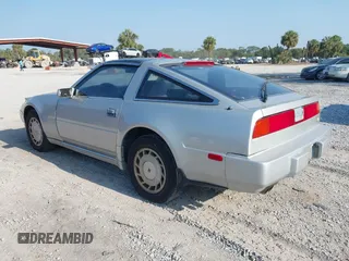 1987 Nissan 300ZX z VIN JN1HZ14S6HX214121, wystawiony jako IAAI lot #42204712 z przebiegiem 218 637 mil mil oraz . Historia ofert i sprzedaży dostępna na DreamBid. Obrazek 3.